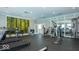Spacious fitness center with treadmills, weight machines, and a serene forest mural at 2556 Lamar Dr, Whitestown, IN 46075