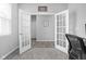 Bright home office featuring french doors, neutral paint, and new carpet at 2556 Lamar Dr, Whitestown, IN 46075