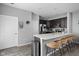 Eat-in kitchen featuring an island with barstool seating, stainless steel appliances, and stylish decor at 2556 Lamar Dr, Whitestown, IN 46075