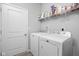 Laundry room featuring a washer, dryer, and shelving space at 2556 Lamar Dr, Whitestown, IN 46075