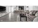 Open-concept living area showcasing seamless flow to the kitchen and modern design at 2556 Lamar Dr, Whitestown, IN 46075