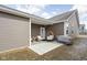 Covered patio with cozy furniture and an outdoor cooking area at 2556 Lamar Dr, Whitestown, IN 46075