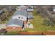 Aerial view of a two-story home featuring a well-maintained yard, basketball hoop, and screened-in patio at 2665 Chestnut St, Columbus, IN 47201