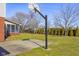 Backyard with a basketball hoop and court, perfect for outdoor activities and recreation at 2665 Chestnut St, Columbus, IN 47201