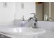 Bathroom sink featuring a modern faucet, soap dispenser, and a pristine white countertop for a clean aesthetic at 2665 Chestnut St, Columbus, IN 47201