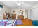 Bedroom featuring hardwood floors, two closets, and a ceiling fan at 2665 Chestnut St, Columbus, IN 47201