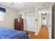 Bright bedroom with a large window, closet, dresser, and ceiling fan offers a cozy and functional space at 2665 Chestnut St, Columbus, IN 47201