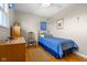 Bedroom featuring a twin bed, hardwood floors, and natural light from a nearby window at 2665 Chestnut St, Columbus, IN 47201