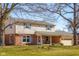 Charming two-story home with brick and siding exterior, two-car garage, and well-maintained front lawn at 2665 Chestnut St, Columbus, IN 47201