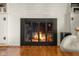 Elegant brick fireplace with black metal screen and mantel in a cozy living space at 2665 Chestnut St, Columbus, IN 47201