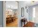 Hallway leading to dining room, featuring hardwood floors and natural light at 2665 Chestnut St, Columbus, IN 47201