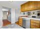 Bright kitchen adjacent to hardwood entry and steps with seamless view to the adjacent living room at 2665 Chestnut St, Columbus, IN 47201