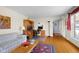 Bright living room with hardwood floors and a dedicated home office space at 2665 Chestnut St, Columbus, IN 47201