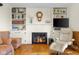 Cozy living room with built-in bookshelves, a fireplace, and comfortable seating area at 2665 Chestnut St, Columbus, IN 47201