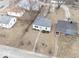 Aerial view showcasing a quaint home nestled among neighboring houses and leafy trees at 2959 N Lasalle St, Indianapolis, IN 46218