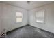A bedroom with gray carpet and bright natural light from two windows at 2959 N Lasalle St, Indianapolis, IN 46218