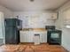 Traditional-style kitchen showcasing basic appliances, ample storage, and natural light at 2959 N Lasalle St, Indianapolis, IN 46218