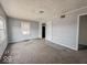 Modest living room featuring neutral carpet, gray walls, and a view from the front window at 2959 N Lasalle St, Indianapolis, IN 46218