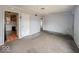 Unfurnished living room boasting gray walls, neutral carpet, and views into connecting rooms at 2959 N Lasalle St, Indianapolis, IN 46218