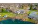 Aerial view of a lakeside home with lush greenery and a tranquil pond offers an idyllic retreat at 3232 Beech Dr, Columbus, IN 47203