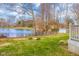 This expansive backyard features a beautiful lake view and a manicured lawn, creating a private and peaceful outdoor retreat at 3232 Beech Dr, Columbus, IN 47203
