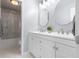 Bright bathroom with double vanity, modern mirrors, and a shower/tub combo featuring marble tile floors at 3232 Beech Dr, Columbus, IN 47203