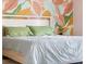 A bedroom with brightly colored floral wallpaper at 3232 Beech Dr, Columbus, IN 47203
