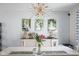 Bright dining room with elegant chandelier and photos on the wall at 3232 Beech Dr, Columbus, IN 47203