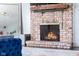 Close-up of the brick fireplace, showcasing its cozy ambiance and design details at 3232 Beech Dr, Columbus, IN 47203