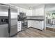 A kitchen with stainless steel appliances and view to the dining room at 3232 Beech Dr, Columbus, IN 47203
