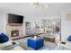 Bright living room with fireplace and view into dining area, showcasing modern decor at 3232 Beech Dr, Columbus, IN 47203