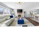 Spacious living room featuring a brick fireplace, modern lighting, and stylish decor at 3232 Beech Dr, Columbus, IN 47203