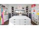 A spacious walk-in closet featuring black shelving and a large island providing ample storage at 3232 Beech Dr, Columbus, IN 47203