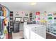 Well-organized walk-in closet with lighting, custom storage, and hardwood floors at 3232 Beech Dr, Columbus, IN 47203