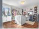 Spacious walk-in closet with natural light, custom storage, and hardwood floors at 3232 Beech Dr, Columbus, IN 47203