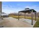 Backyard with a gazebo sitting on a large concrete pad next to a hot tub at 3328 Stoddard Pl, Indianapolis, IN 46217