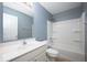 Cozy bathroom with modern fixtures, a vanity with solid countertops, and a shower-tub combination at 3328 Stoddard Pl, Indianapolis, IN 46217