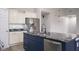 Stylish kitchen island boasts a stainless steel dishwasher and extra counter space at 3328 Stoddard Pl, Indianapolis, IN 46217