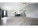 Bright and airy living room with wood-look floors, cathedral ceilings, recessed lighting and a view of the kitchen at 3328 Stoddard Pl, Indianapolis, IN 46217