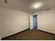Spacious basement with carpet and white walls, offering potential for customization at 3516 N Sherman Dr, Indianapolis, IN 46218