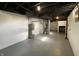 Finished basement shows painted walls, epoxy flooring, HVAC, and water heater at 3516 N Sherman Dr, Indianapolis, IN 46218