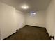 Finished basement featuring neutral carpet, and ample space for storage at 3516 N Sherman Dr, Indianapolis, IN 46218