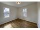 Bright bedroom with two windows and new floors at 3516 N Sherman Dr, Indianapolis, IN 46218