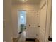 Hallway view leading to a bathroom with a green vanity at 3516 N Sherman Dr, Indianapolis, IN 46218