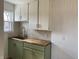 Bright kitchen featuring stylish countertops, green cabinetry and modern fixtures at 3516 N Sherman Dr, Indianapolis, IN 46218