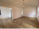 Spacious living room with freshly painted walls and durable wood flooring at 3516 N Sherman Dr, Indianapolis, IN 46218