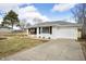 Ranch-style home with driveway and well-manicured lawn, offering curb appeal at 3626 St. Charles St, Anderson, IN 46013