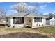 Ranch style home featuring a well-kept lawn, updated front porch, and white siding at 3626 St. Charles St, Anderson, IN 46013