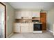 Bright kitchen featuring classic cabinetry and functional appliances at 3626 St. Charles St, Anderson, IN 46013