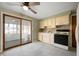 Cozy kitchen with light cabinetry, marble floors, and view to sunroom at 3626 St. Charles St, Anderson, IN 46013